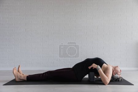 Photo for Sporty woman doing yoga - Royalty Free Image