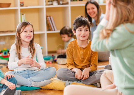 Photo for Active preschool Children Interacting with their Teacher.   Early Learning. Healthy Learning Environment - Royalty Free Image