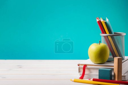 Photo for Background with pencils and apple with books - Royalty Free Image