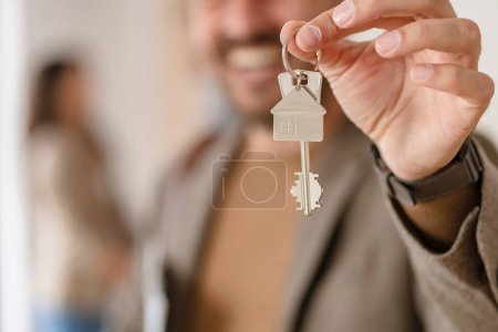 Photo for Couple buying a new flat with realtor - Royalty Free Image