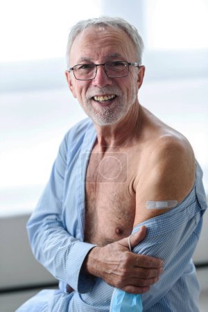 Photo for Elderly man , sitting after getting vaccinated - Royalty Free Image