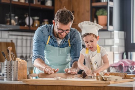 Photo for Father cooking with son together - Royalty Free Image
