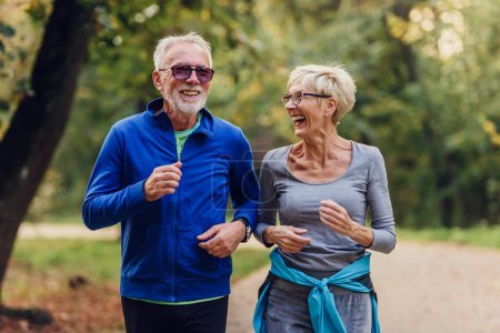 Photo for Senior couple jogging in the park - Royalty Free Image
