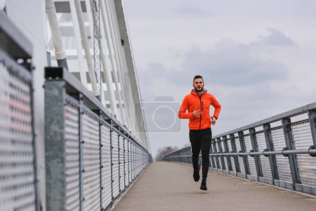 Photo for Young man running in the city - Royalty Free Image