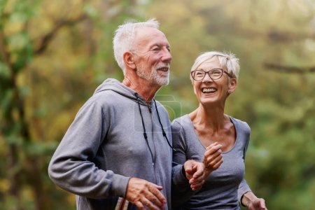 Photo for Senior couple jogging in the park - Royalty Free Image