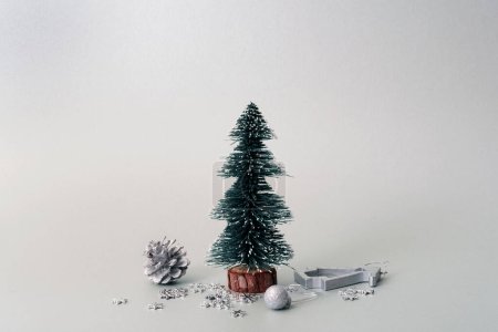 Photo for Beautiful shot of a fir tree with a blue christmas decoration on a white background - Royalty Free Image