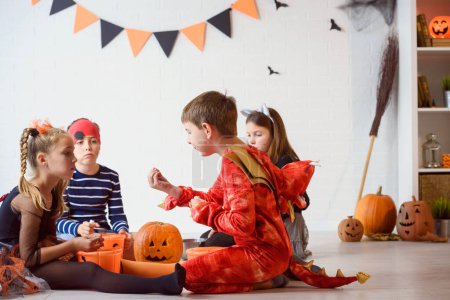 Photo for Little boys and girls with halloween pumpkins - Royalty Free Image