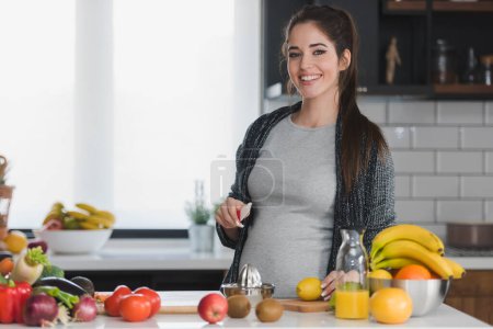 Photo for Woman cutting fruits in kitchen, healthy food concept - Royalty Free Image