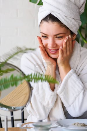 Photo for Beautiful young woman making natural mask from cucumber, lemon and honey - Royalty Free Image