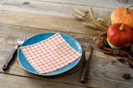 Photo for Thanksgiving dinner table setting with pumpkins - Royalty Free Image