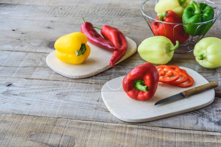 Photo for Bell peppers on wooden background - Royalty Free Image