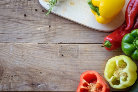 Photo for Fresh bell peppers on wooden background - Royalty Free Image