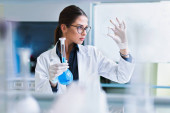 young woman scientist working in the lab  Poster #653507946