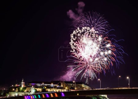 Photo for Fireworks over the river at night - Royalty Free Image