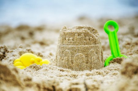 Photo for Sand and beach toys on the sandy shore - Royalty Free Image