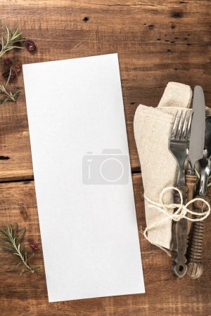 Photo for Wooden Restaurant Table with Blank Menu Vertical - Royalty Free Image