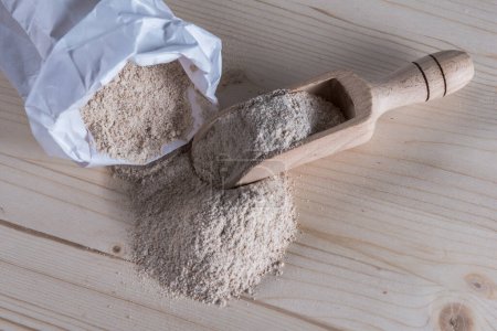 Photo for Spelt Flour on wooden background - Royalty Free Image