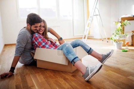 Photo for Happy young couple enjoying in their new empty apartment - Royalty Free Image