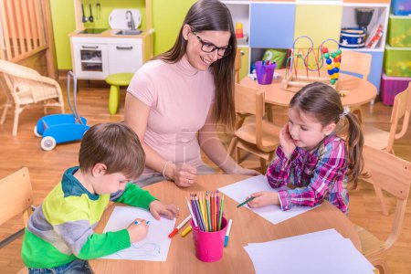 Photo for Cute little kids drawing at kindergarten - Royalty Free Image