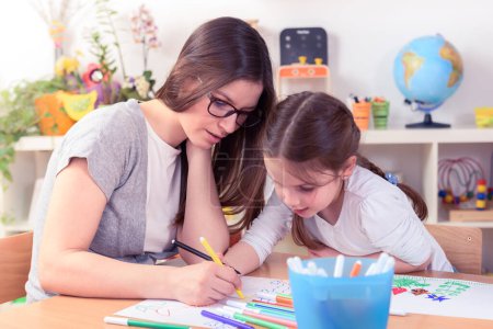 Photo for Teacher and Cute Little Girl Drawing Lessons Art Class - Royalty Free Image
