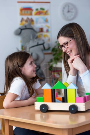 Photo for Portrait of Preschool Teacher With Cute Girl - Royalty Free Image