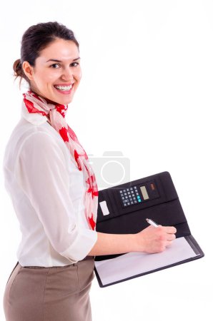 Photo for Business Woman Looking at Agenda/Notebook - Side View - Royalty Free Image