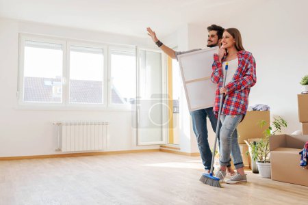 Photo for Young couple moving into new home - Royalty Free Image