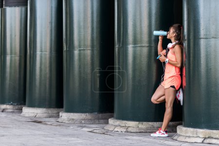 Photo for Fitness girl drinking water - Royalty Free Image