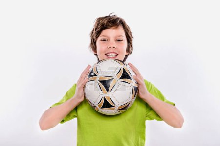 Photo for Boy holding soccer ball close up portrait - Royalty Free Image