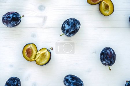 Photo for Fresh ripe plums on a white background - Royalty Free Image