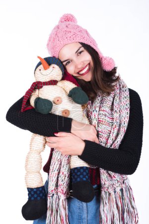 Téléchargez les photos : Bonne fille d'hiver avec poupée bonhomme de neige - en image libre de droit