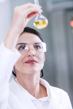 Photo for Young female chemist in the laboratory - Royalty Free Image