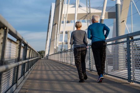 Photo for Senior couple running in city - Royalty Free Image