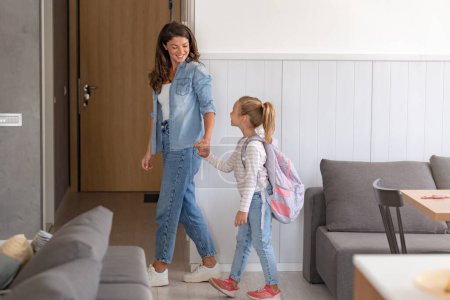 Photo for The child is going back to school. Mother and kid getting ready for the first school day. Little girl and mom going to school - Royalty Free Image