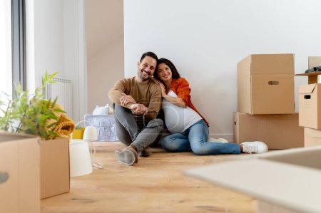 Photo for Happy young couple moving in a new home - Royalty Free Image