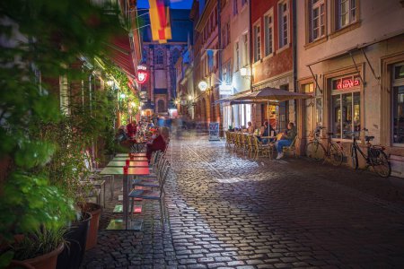 Photo for HEIDELBERG, BADEN-WUERTTEMBERG, GERMANY - CIRCA MAY, 2023: The Steingasse of Heidelberg town, Germany. - Royalty Free Image
