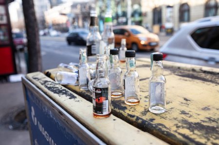 Photo for BUDAPEST, HUNGARY - FEBRUARY 27, 2022: Selective blur on empty miniature alcohol bottles scattered in a street of budapest after a hunge binge drinking party - Royalty Free Image