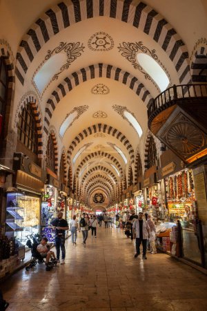Photo for ISTANBUL, TURKEY - MAY 21, 2022: Selective blur on the main alley of the Spice Egyptian Bazaar of istanbul, crowded, with shops and people, turks. It's a major landmark and market. - Royalty Free Image