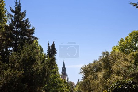 Photo for Selective blur on the Subotica City Hall, in Serbia, during a sunny summer afternoon seen behind trees. Called Gradska Kuca, it is the main landmark of the city, inaugurated in 1910 - Royalty Free Image