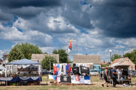 Foto de RUMA, SERBIA - JUNE 26, 2022: Selective blur on a stand selling Serbian Nationalist items in a market of Ruma. Such items are typical of Serbian far right - Imagen libre de derechos