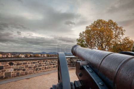Photo for Picture of the old cannon on the alter zoll am rhein in Bonn, overlooking the rhine river. The Alter Zoll, or old customs, is part of the park on the Bonn fortifications of dreikoningen. - Royalty Free Image