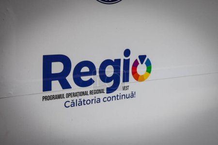 Photo for BAILE HERCULANE, ROMANIA - SEPTEMBER 15, 2022: Sign with the logo of Regio Program, or Programul Operational Regional; a regional development program co financed by the European Union. The EU is one of the main funding donor in Romania. - Royalty Free Image