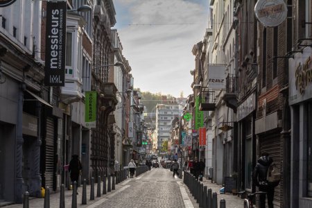 Photo for LIEGE, BELGIQUE - NOVEMBER 9, 2022: Selective blur on Rue Saint Gilles, a shopping street of the city center of Liege, with facades of old buildings and shops and boutiques with their iconic signs. - Royalty Free Image