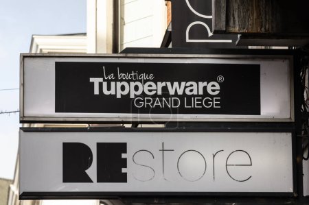 Photo for LIEGE, BELGIUM - NOVEMBER 8, 2022: Logo of Tupperware on their boutique for Liege. Tupperware is an American brand of kitchenware known for plastic boxes, containers and canisters. - Royalty Free Image
