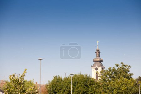 Photo for Panorama of the city center of Sremska Mitrovica, Serbia, with houses roofs and the clocktower steeple arhiv, Crkva Svetog Dimitrije orthodox church with typical austro hungarian baroque architecture. - Royalty Free Image