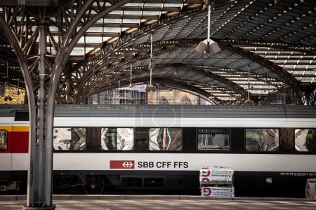 Photo for COLOGNE, GERMANY - NOVEMBER 12, 2022: Passenger train with swiss railways logo of SBB CFF FFS in international train in Koln HBF, Cologne main train station. it's the main train carrier of Switzerland. - Royalty Free Image