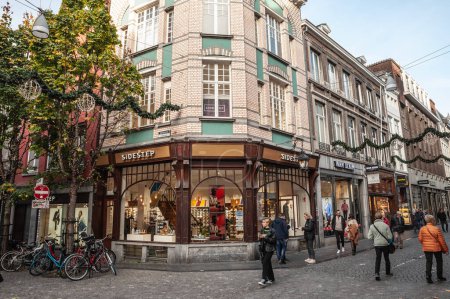 Photo for MAASTRICHT, NETHERLANDS - NOVEMBER 10, 2022: Panorama of a fashion store on the Grote Straat street in Maastricht city center, a pedestrian street surrounded by shops and stores. - Royalty Free Image
