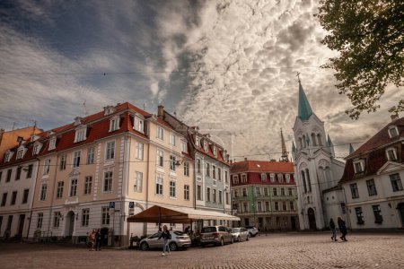 Photo for RIGA, LATVIA - AUGUST 22, 2023: Panorama of the Pils Laukums square in Riga, a pedestrian cobblestone street and square of Vecriga Vecpilseta, the historical center old town of Latvian capital city. - Royalty Free Image
