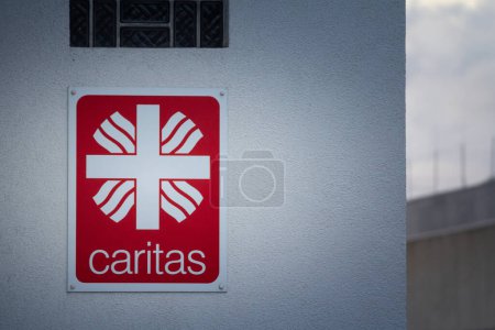 Photo for AACHEN, GERMANY - NOVEMBER 8, 2022: Logo of Caritas International (Caritas Deutschland) on their Aachen office. Caritas is a catholic relief and humanitarian aid organization. - Royalty Free Image