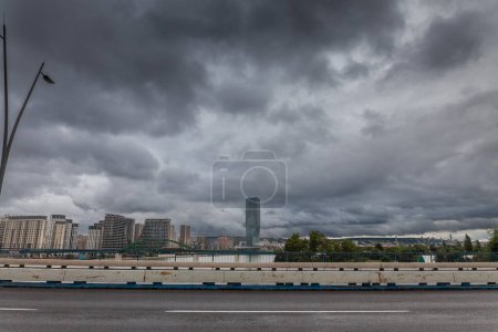 Photo for Panorama of the skyline of Belgrade, over the sava river in a cloudy sky with Belgrade waterfront, or Beograd na vodi, behind. It's a controversed luxury real estate project. - Royalty Free Image